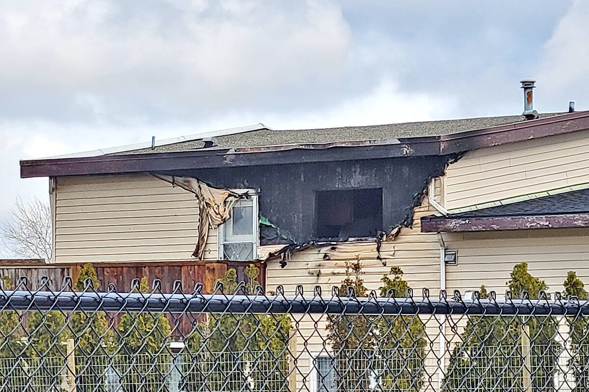 A multi-unit residential building was damaged by fire in Langley near 216th St. and 56th Avenue on Sunday, Feb. 20. No serious injuries were reported, with the exception of a cat that was administered oxygen. (Dan Ferguson/Langley Advance Times)