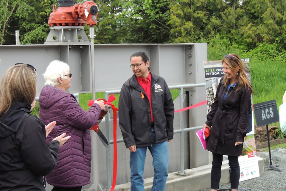 Mayor Sylvia Pranger and Cheam First Nations Chief Andrew Victor smile as the ribbon is officially cut at the Lower Agassiz Slough floodgate. The new floodgate offers not only improved flood protection but easier access for salmon traveling the waterways of the Fraser River. (Adam Louis/Observer)