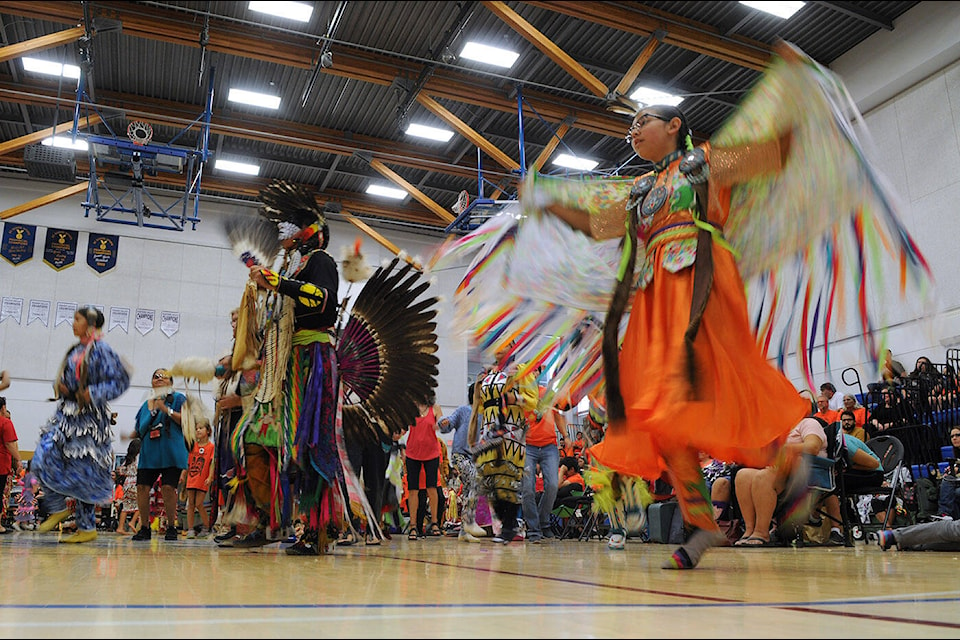 People take part in the intertribal dance during the Truth and Reconciliation Powwow at Chilliwack Secondary School on Saturday, Oct. 1, 2022. (Jenna Hauck/ Chilliwack Progress)