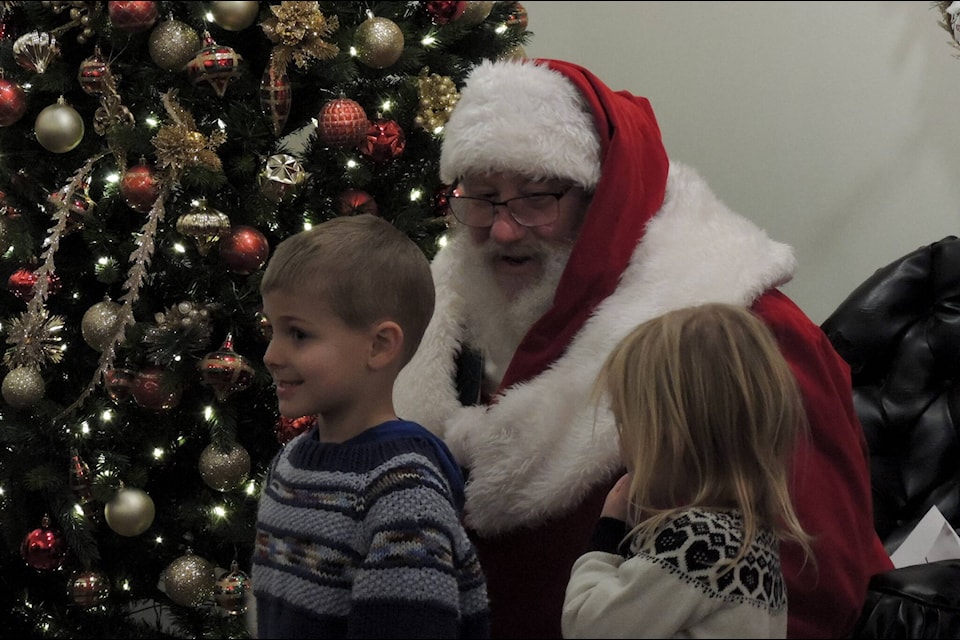 Santa visited with dozens of children throughout the first weekend events of Winter Night Lights on Saturday, Dec. 3. (Adam Louis/Observer)