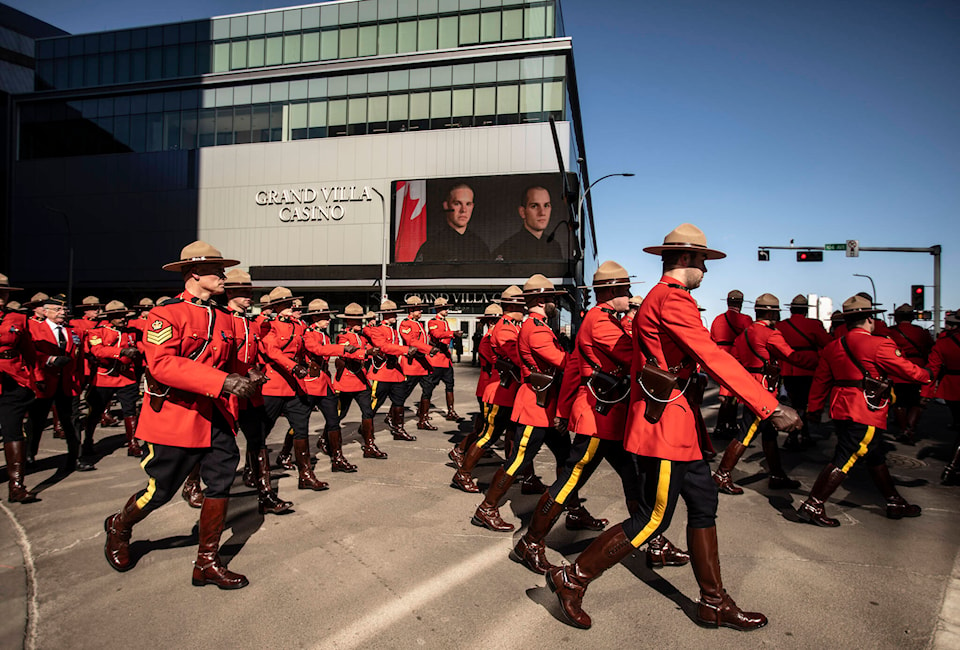 32255147_web1_230327-CPW-Funeral-Edmonton-officers-shotand-killed-march_1