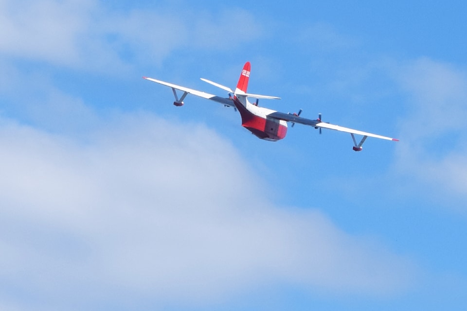 The Hawaii Mars flies over Sproat Lake one final time on Sunday, Aug. 11.