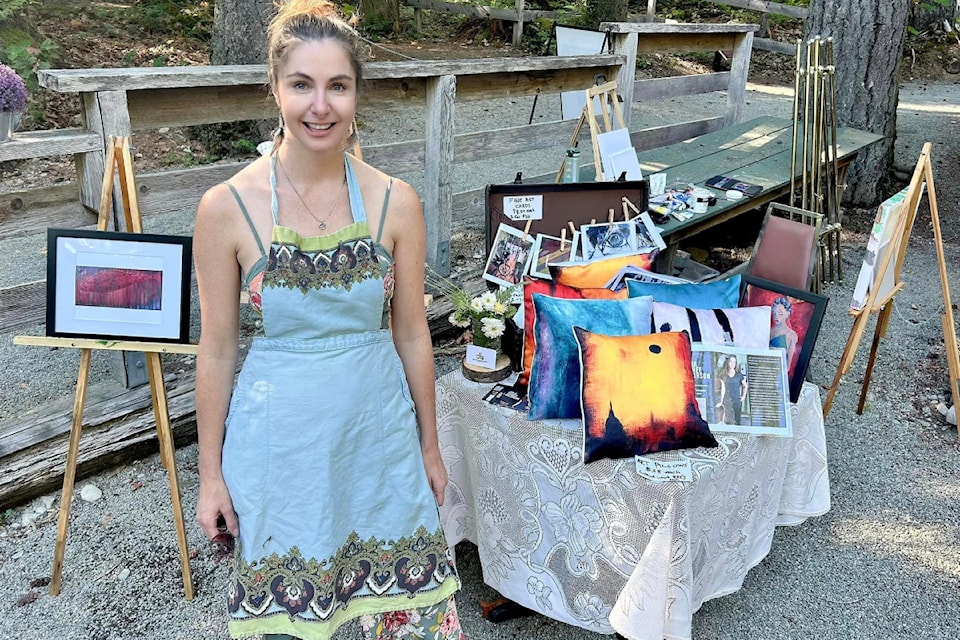 Live painter Julia Oscarson displays some of her work at the Aug. 11, 2024 Teas at the Mill. 