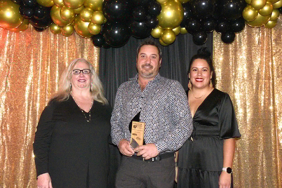 Gordon McIntyre, centre, of Skytec Contracting Canada earned Business of the Year from the 2024 Alberni Valley Chamber of Commerce Business Excellence awards. 