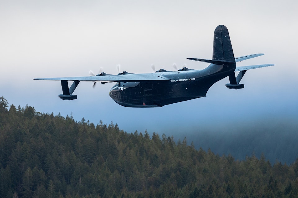 The Philippine Mars appears to be skimming the treetops along Taylor Arm on Sproat Lake during the waterbomber's first brief flight since 2007. 