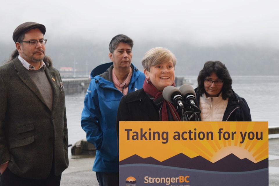 Josie Osborne, the province's Minister of Health, speaks to the media outside of Lady Rose Marine Services in Port Alberni. Accompanying her are John Jack (Huu-ay-aht First Nations Chief Councillor), Brandy Lauder (Hupacasath First Nation Elected Chief Councillor) and Debra Toporowski (Parliamentary Secretary for Rural Health).