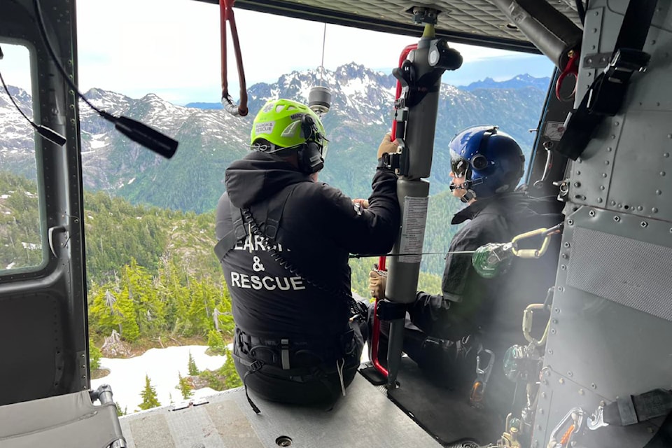 Crew members from Alberni Valley Search and Rescue and Ascent Helicopters fly to 5040 Peak west of Port Alberni where four hikers were stranded June 24, 2024. 