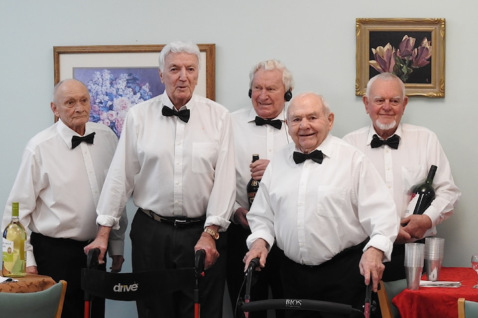 Some of the Abbeyfield House residents dress up to serve staff members during an appreciation dinner. 