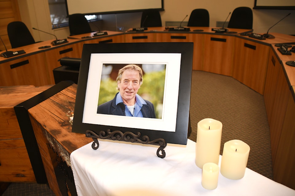 A memorial for City of Port Alberni Councillor John Douglas is set up at the front of an empty city council chambers on Monday, July 15, 2024. Douglas died suddenly at home last week. 