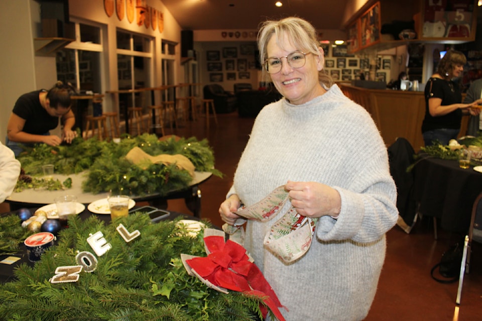 Rhonda Maczulat was busy adding ribbons to her wreath.