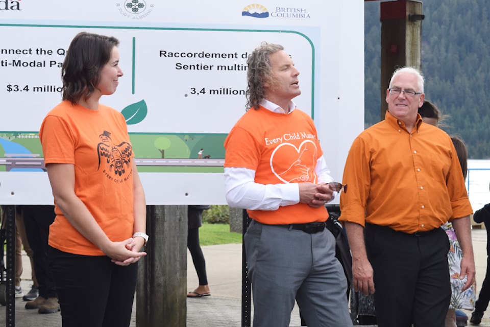 City CAO Mike Fox (centre) speaks to the crowd gathered at Harbour Quay on Monday, Sept. 23 while Mayor Sharie Minions and Coun. Todd Patola look on.