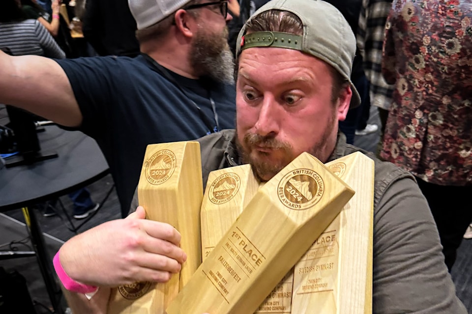 Aaron Colyn, owner of Twin City Brewing in Port Alberni, juggles his five trophies from the British Columbia Beer Awards.