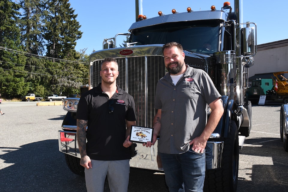Tyler Parrotta, left, and Jason Bakken hold their "mayor's choice" award in front of their custom 2025 Peterbilt 589, Aug. 31, 2024 at the annual Antique Truck Show in Port Alberni. The pair brought the truck from Peterbilt Pacific in Lantzville. The Western Vancouver Island Industrial Heritage Society hosted the three-day show at their facility on Ninth Avenue. Visitors were treated to dozens of new and classic trucks outdoors, and a tour and hands-on activities inside the centre. 
