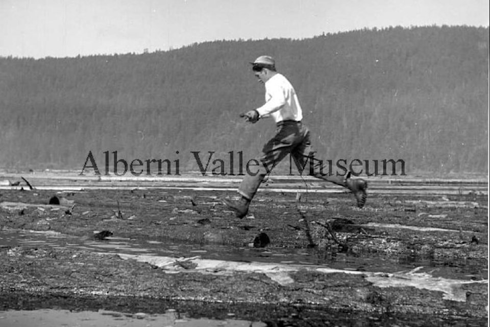 This undated photo shows a man jumping across a log boom. To view more than 24,000 historical Port Alberni photos, visit the Alberni Valley Museum’s online photo archives at portalberni.pastperfectonline.com.