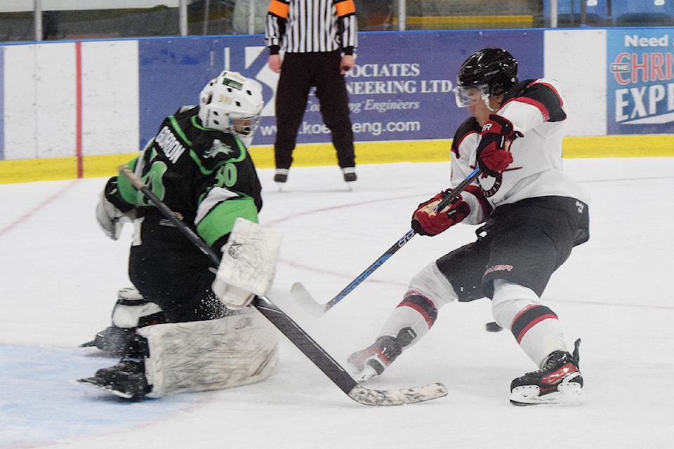 Lake Cowichan Kraken goaltender Myles Gordon makes a save on a penalty shot by Port Alberni Bombers forward Leim Smith.