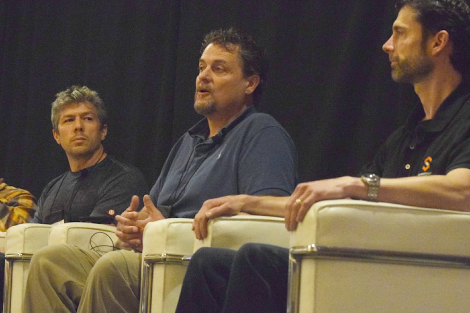 Ben Durkan, Tseshaht forester, speaks at a panel for the Indigenous Forestry Conference on Sept. 11, 2024 while Gerald Cordeiro (left) and Domenico Iannidinardo (right) look on.