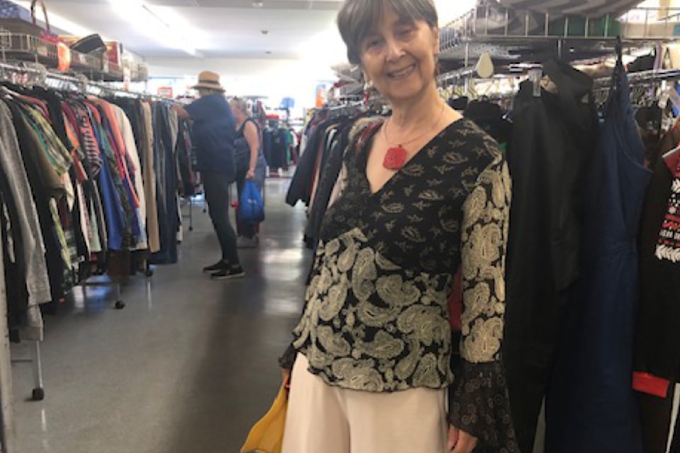 Customer Lori wears an outfit made entirely of items found at The Attic.