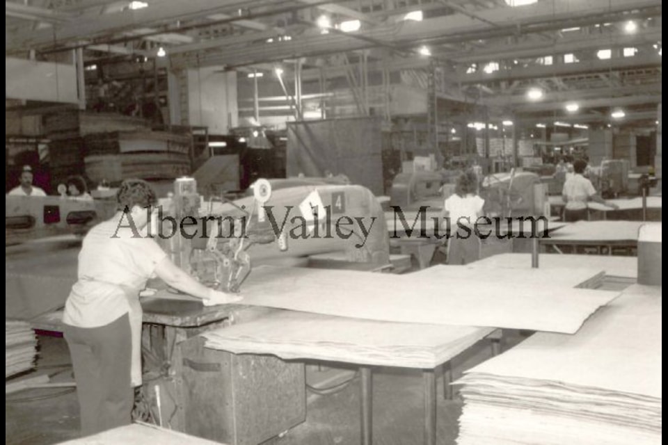 This undated photo shows several people at work inside the Alberni Plywood Plant. The machinery is identified as a Raimann patcher, which is a machine for punching out and plugging defects in veneer. To view more than 24,000 historical Port Alberni photos, visit the Alberni Valley Museum’s online photo archives at portalberni.pastperfectonline.com.