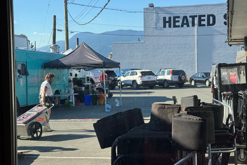 A film crew set up outside of Smitty's restaurant fill the parking lot.