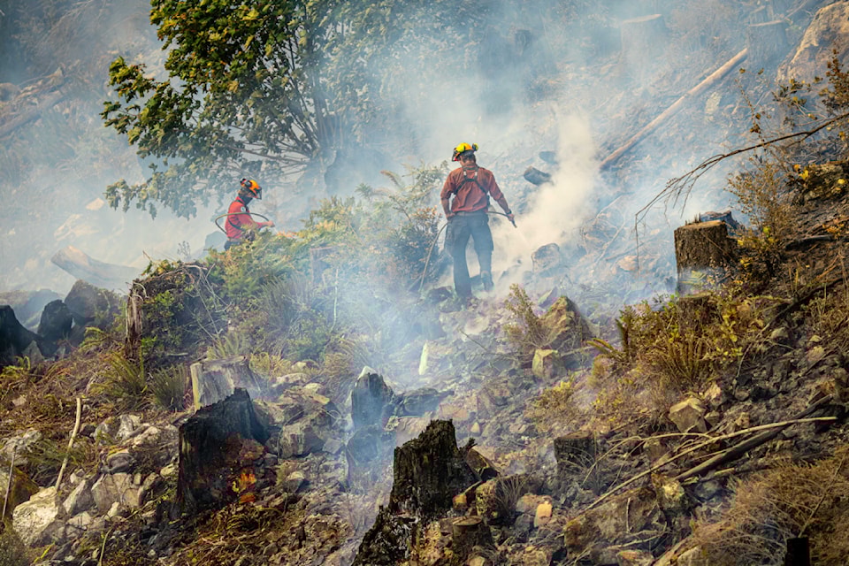 Wildland firefighters attack the steep terrain of the Mount Underwood fire to extinguish hotspots and dig up smouldering areas, several days after the fire ignited on Aug. 11, 2025. (BCWS PHOTO)