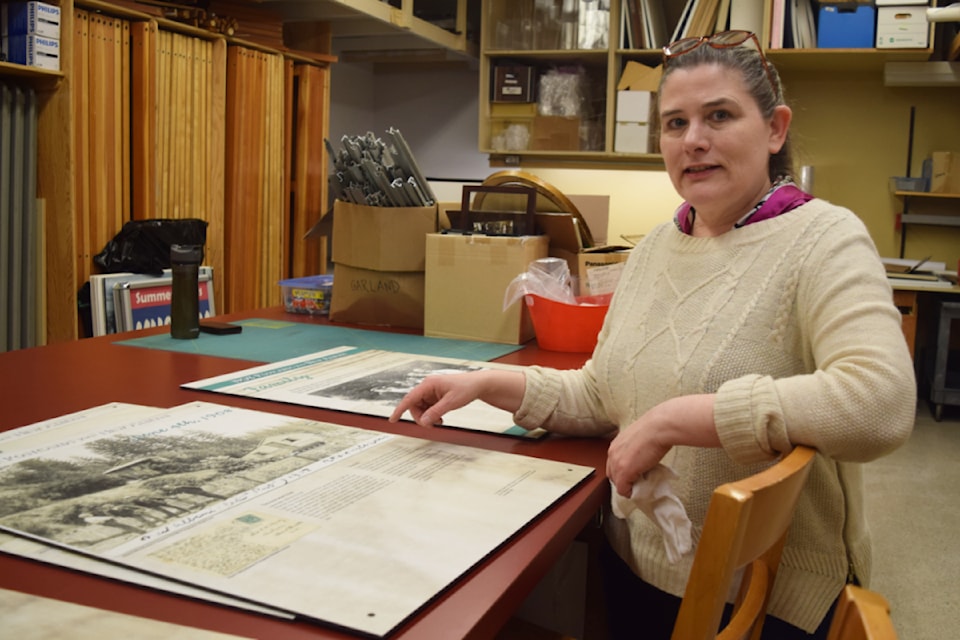 Kirsten Smith, collections curator at the Alberni Valley Museum, shows off pictures of the newest exhibit.