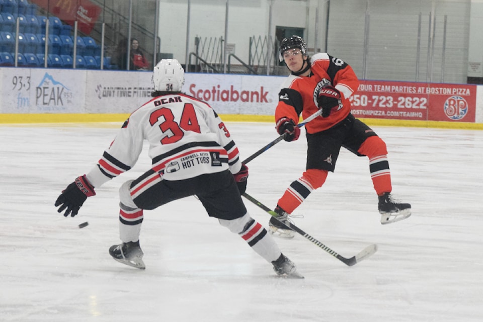 Port Alberni Bombers defenceman Luke Ridgway fires a shot past Campbell River Storm forward Draeden Bear during a powerplay opportunity on Feb. 12, 2025.