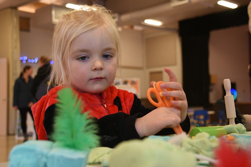 Giavanna McCool plays with playdough at one of the kids' tables at Echo Centre during Family Literacy Day on Feb. 1, 2025. 