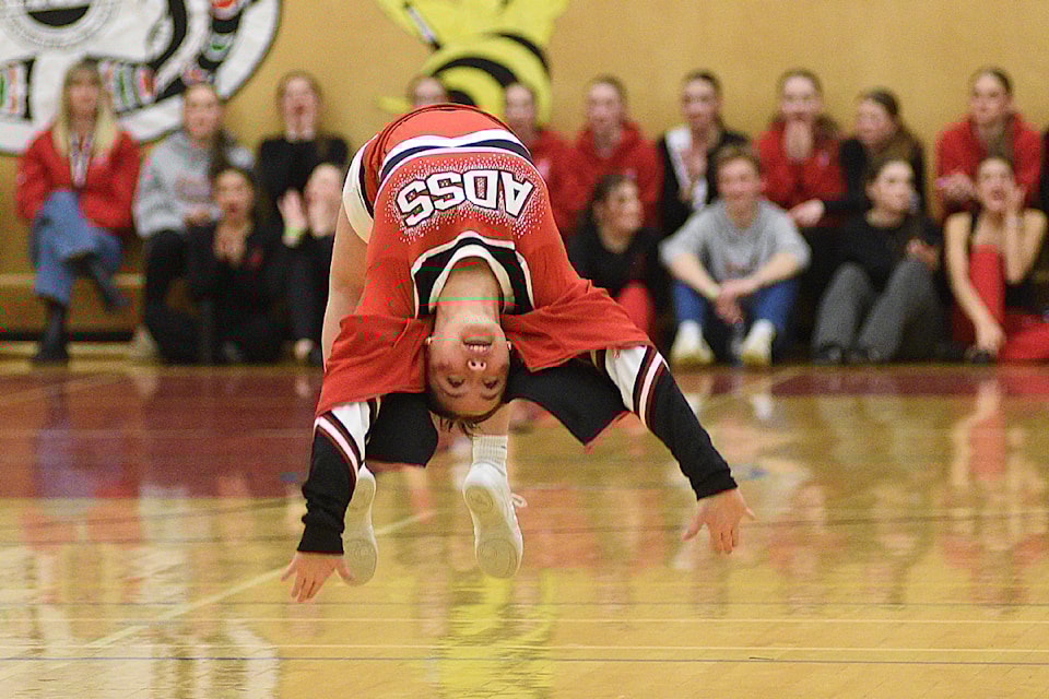 A member of the ADSS Storm cheer team tumbles her way along the floor during a timeout in the first quarter of the senior girls' game against Belmont on Friday, Jan. 10, 2025 during Totem 69. 