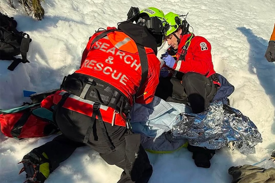 Members of Alberni Valley Rescue Squad attend to a snowshoer with a lower leg injury on 5040 Peak on Jan. 18, 2025. 