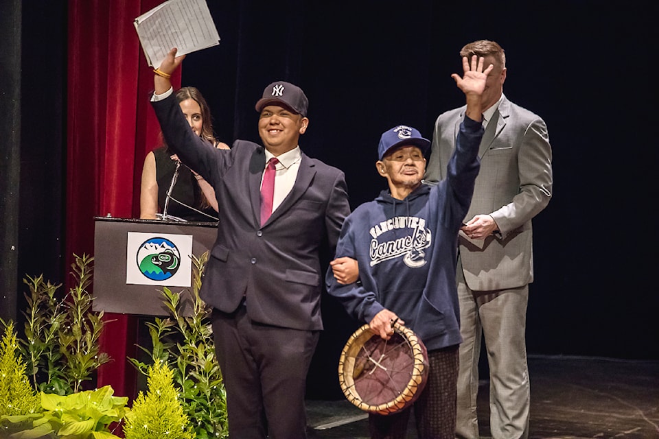 Eighth Avenue Learning Centre valedictorian Stephen Mack Jr. finishes his speech and invites his drummer to acknowledge the crowd on stage at the EALC Grad ceremony, June 19, 2025 at the ADSS Theatre. (LYNDON CASSELL/ Alberni Valley News)