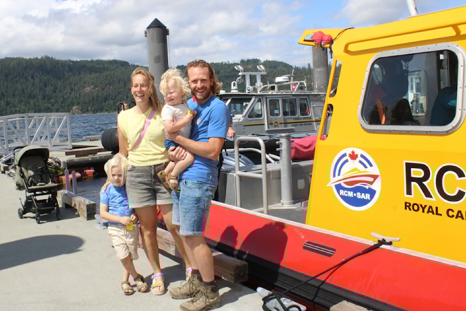 Jolijn and Edwin Heesakker with their children Scott, 2, and Mick, 4, check out the Royal Canadian Marine SAR vessel on Port Day at the Port Alberni waterfront, June 14, 2025. (SONJA DRINKWATER/ Alberni Valley News)