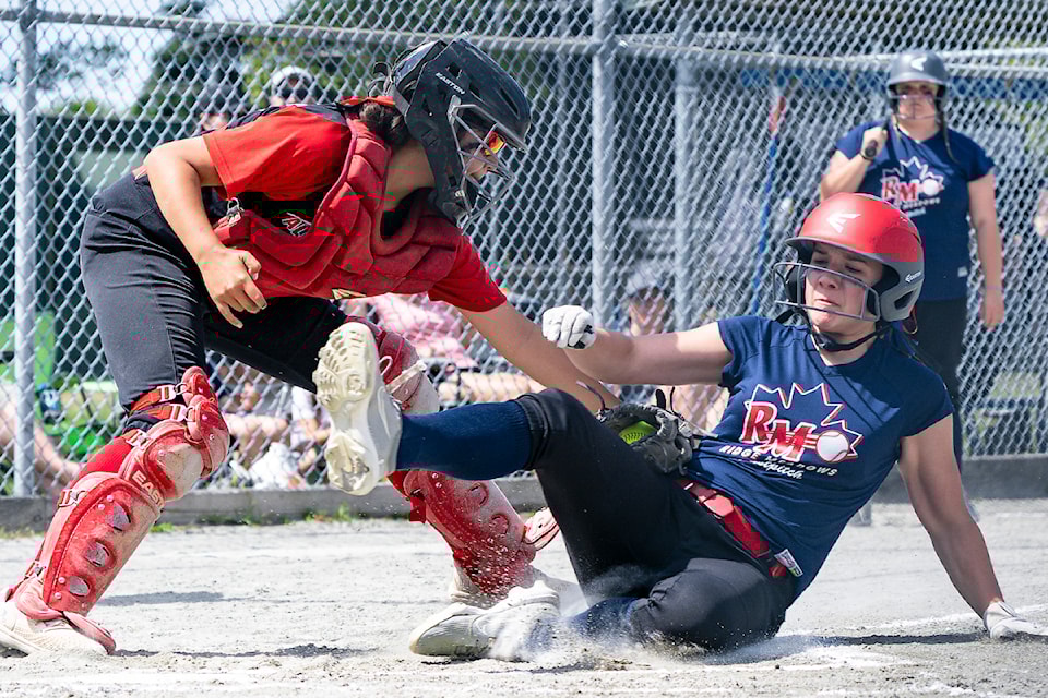 Alberni Blazers U15C backcatcher Samara August tags a Ridge Meadows runner out at home plate during the B.C. provincial championships in Steveston the weekend of July 5, 2025. (SUBMITTED PHOTO/ Alberni Valley News)