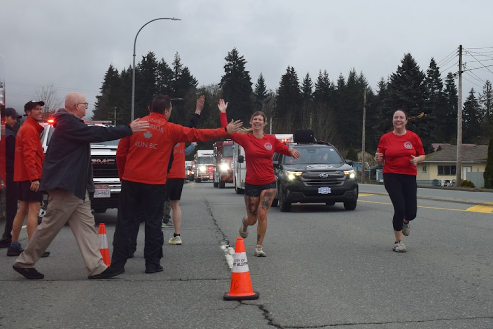 Members of the Wounded Warriors team high-five their supporters during their arrival in Port Alberni on Thursday, Feb. 27.