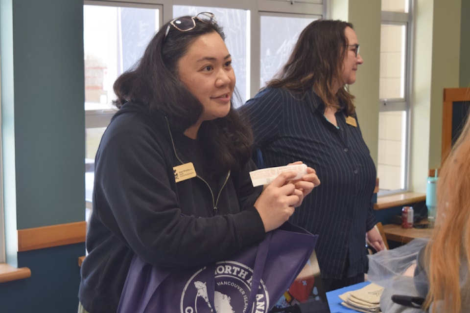 Aimee Wheatley, an instructor with NIC's practical nursing program, shows prospective students "What's in a nurse's bag?" In this case, the item is a syringe.