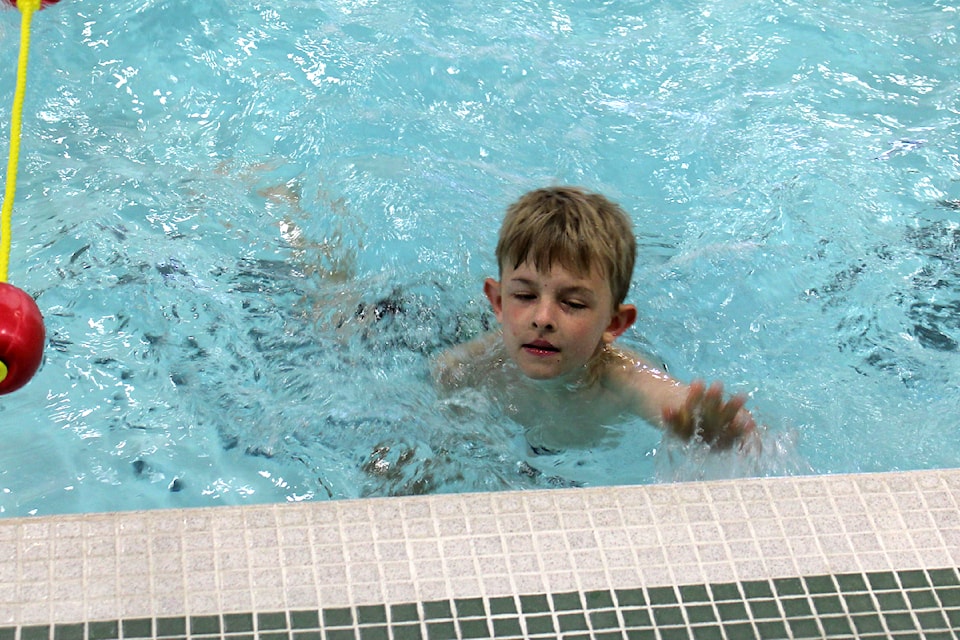 A young participant finishes a lap in the swimming section of the inaugural Port Alberni Kids' Tri-K, May 3, 2025 at Echo Pool. (SONJA DRINKWATER/ Alberni Valley News) 