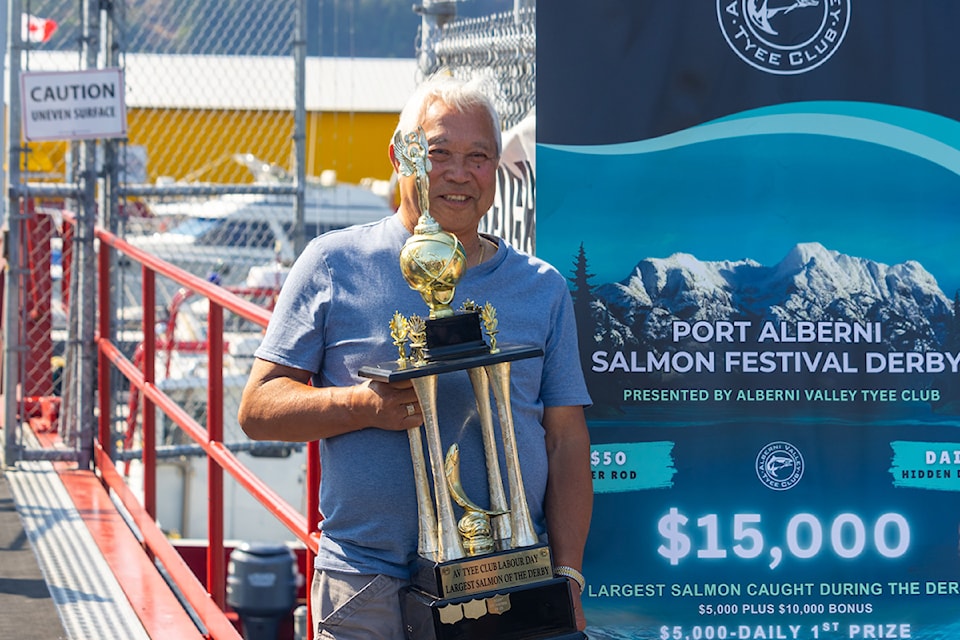 Don Kimura wins the first place prize for the three-day Salmon derby event. Here he holds the trophy after being handed his $15,000 cheque.