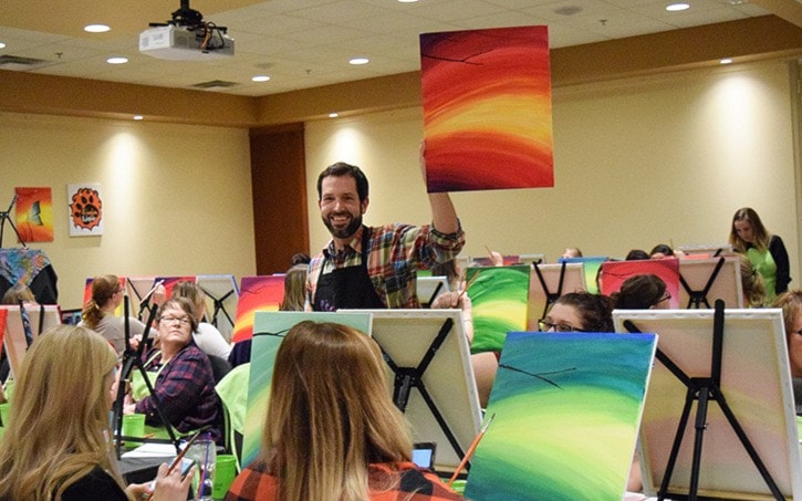 Paint Nite instructor Ty Bate gives step-by-step instructions.