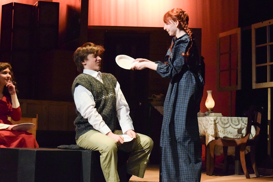 Anne Shirley (played by Kendra Neary) breaks her slate over Gilbert Blythe’s (played by Justin MacFadden) head during a rehearsal of Anne of Green Gables performed by the STAGES Youth Theatre Company. Elena Rardon photo