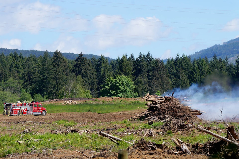 The Cherry Creek Fire Department was called to a property on Moore Road on Wednesday, May 24 after receiving a call that fire was spreading from large burn piles to nearby shrub. KARLY BLATS PHOTO