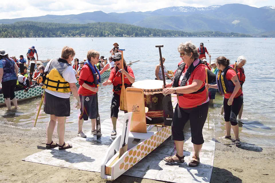 Port Alberni’s Die Hard Dragons celebrate their first place win during the 12th heat of the Dragon Boat Regatta at Sproat Lake on Sunday, June 11, 2017. ELENA RARDON PHOTO.