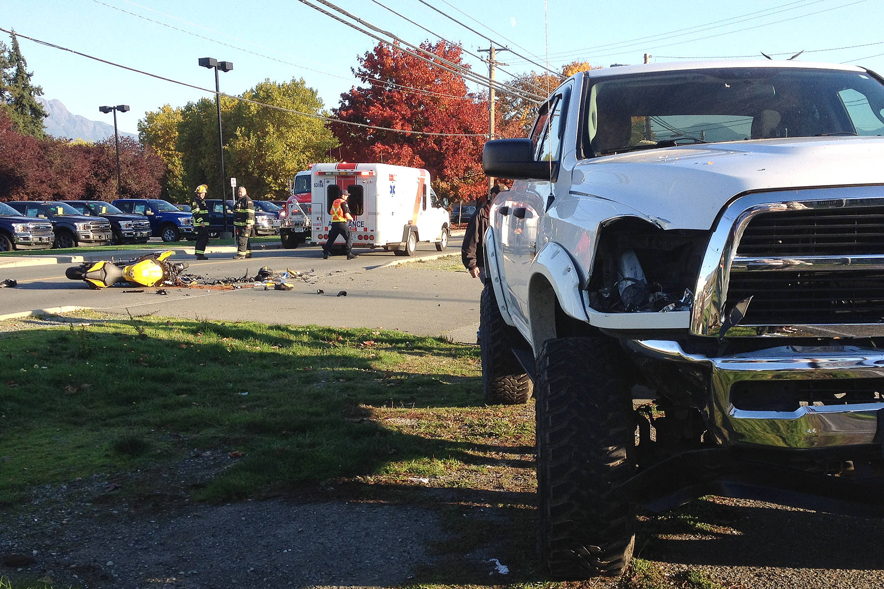 A Dodge pickup truck suffered a broken headlight and front end damage after striking a Yamaha motorcycle, at left, on Beaver Creek Road in Port Alberni Saturday, Oct. 28, 2017.