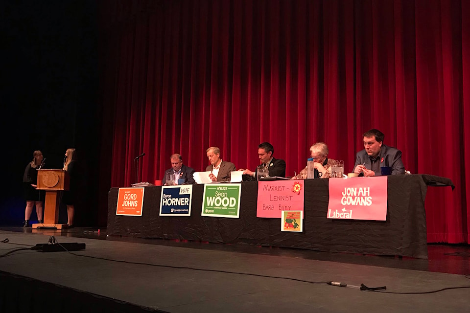 Courtenay-Alberni candidates seated in the Alberni District Secondary School Theatre before the start of the All Candidates Meeting on Oct. 9. ELENA RARDON PHOTO