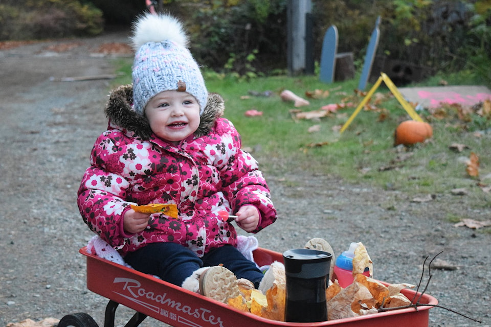 Sawyer Schut (almost two years old) was happy with her collection of candy from McLean Mill on Saturday. ELENA RARDON PHOTO