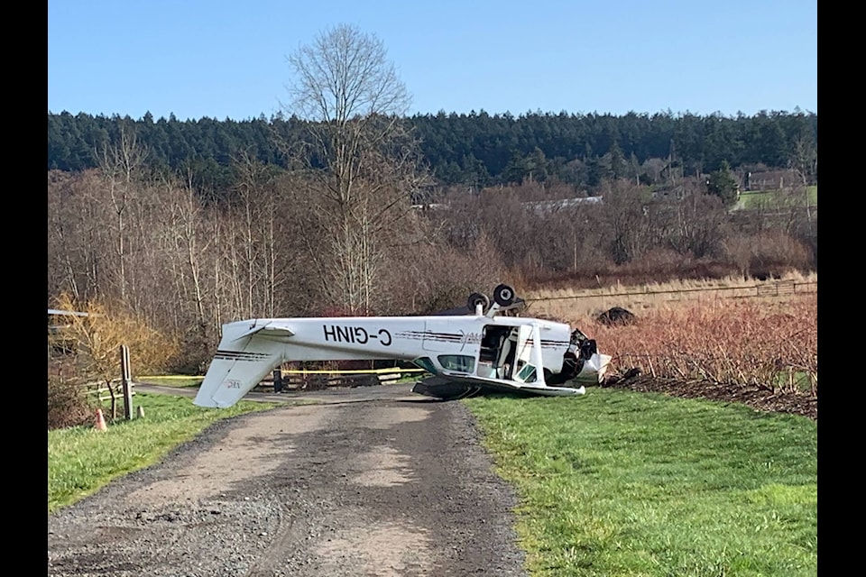 Saanich Fire can be seen attending to a crashed Cessna 172 in the driveway of 1020 Beckwith Avenue in Saanich. The plane crashed at about 8:55 a.m. (Shalu Mehta/Black Press Media)