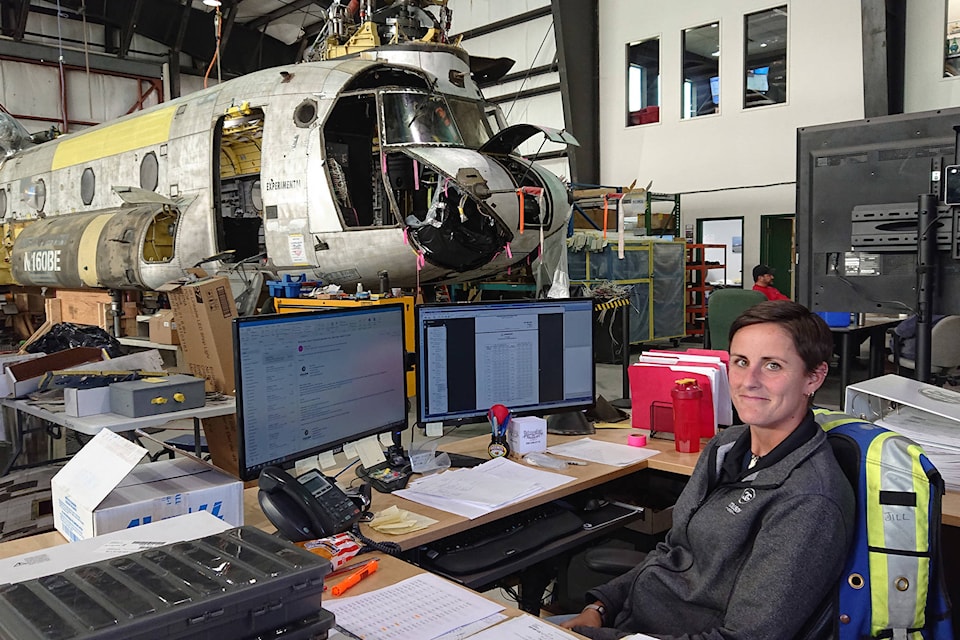 Jill Paupst, dock controller, works next to a CH-47D at Coulson Aviation. The Port Alberni-based company has doubled its fleet of aerial firefighting aircraft in the past couple of years. (MIKE YOUDS/ Special to the AV News)