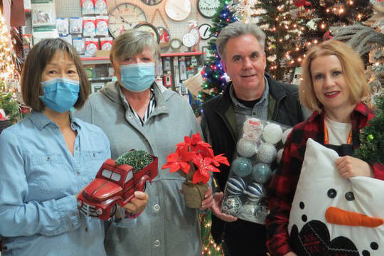 Alberni Valley Hospice Society Board member Gerri Sing and Executive Director Teresa Ludvigson join Jan and Karen Lavertu, owners of West Coast Home Hardware Port Alberni in preparing for Light Up Hospice. The official light up is Dec. 1, and the decorations will adorn the AVHS community office throughout the month.