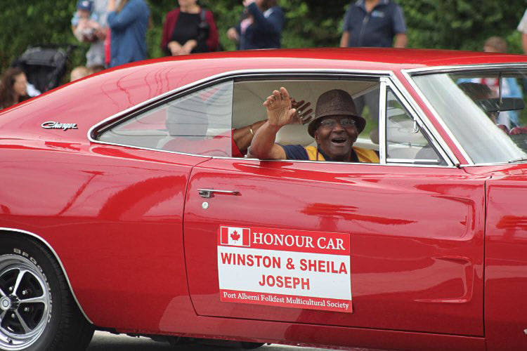 Winston Joseph, known as Mr. Positive Port Alberni, leads the 2019 Canada Day parade with his wife Sheila. Winston, who was integral in starting the July 1 folkfest, died April 11, 2021 at the age of 89. (PHOTO COURTESY SONJA DRINKWATER)