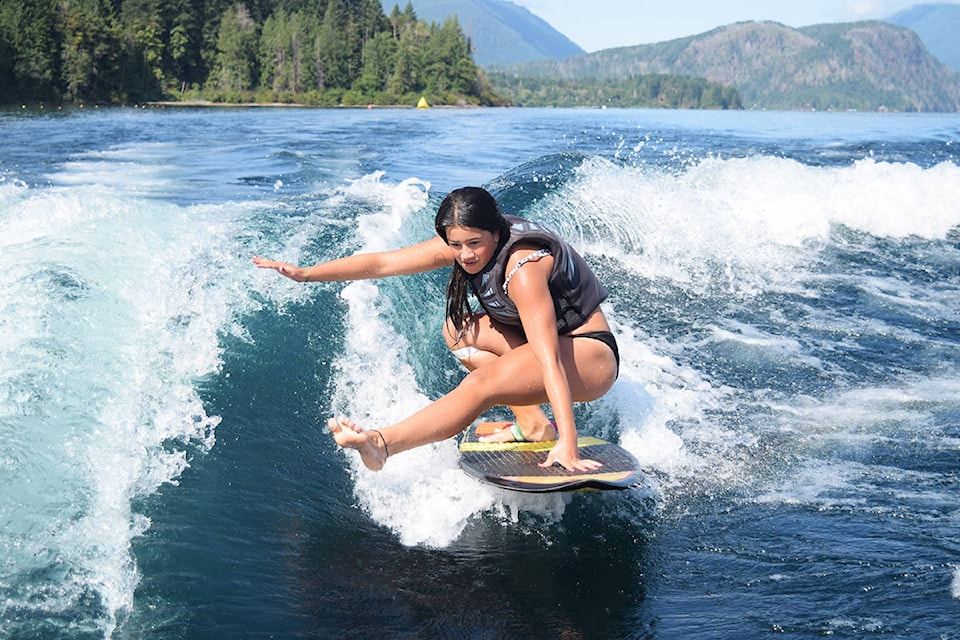 Brooke Mauke performs a trick during the Female Amateur wake surf competition on Aug. 8. (ELENA RARDON / ALBERNI VALLEY NEWS)