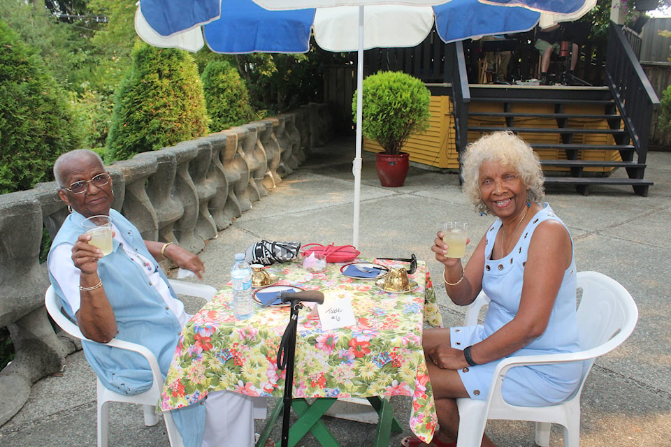 Sheila Joseph and Desiree Irwin enjoyed a cold drink and conversation at the Rollin Art Centre’s Tea on Terrace. (SONJA DRINKWATER/ Alberni Valley News)