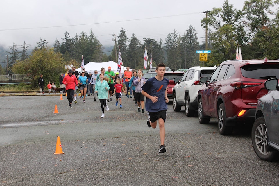 Keiran Veilleux, age 14, starts out on the 5-km run. He finished with a time of 25 minutes. (SONJA DRINKWATER / ALBERNI VALLEY NEWS)